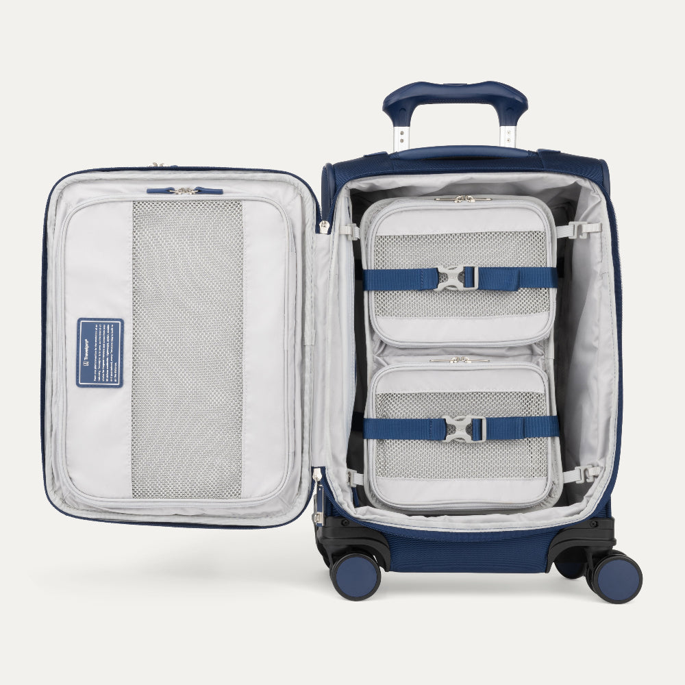 Blue suitcase with open compartment showing organized packing