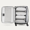 Open spinner suitcases in black , showing the interior compartments on a white background